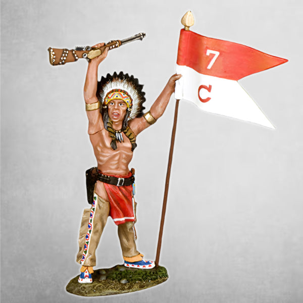 A sioux warrior celebrates the capture of a 7th Cavalry guidon.